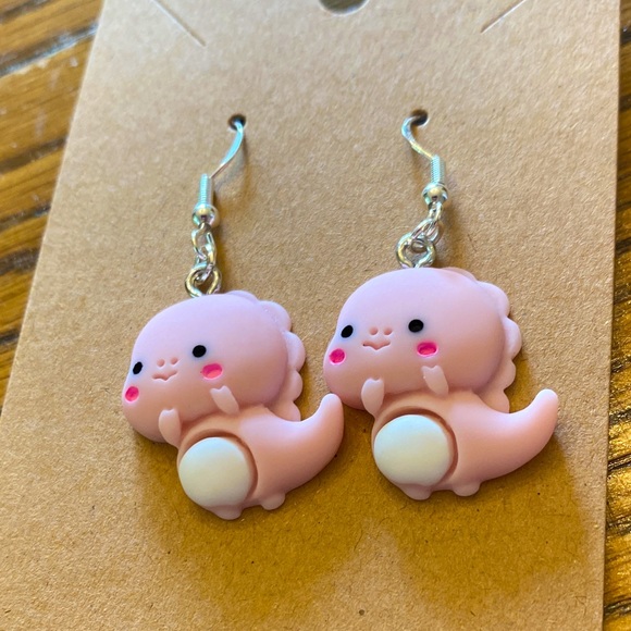 New baby dinosaur earrings on silver wires with random colored gift bags. - Picture 1 of 6